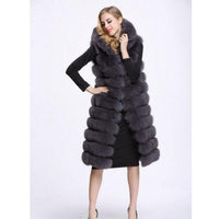 Long faux fur vest styled over a dress