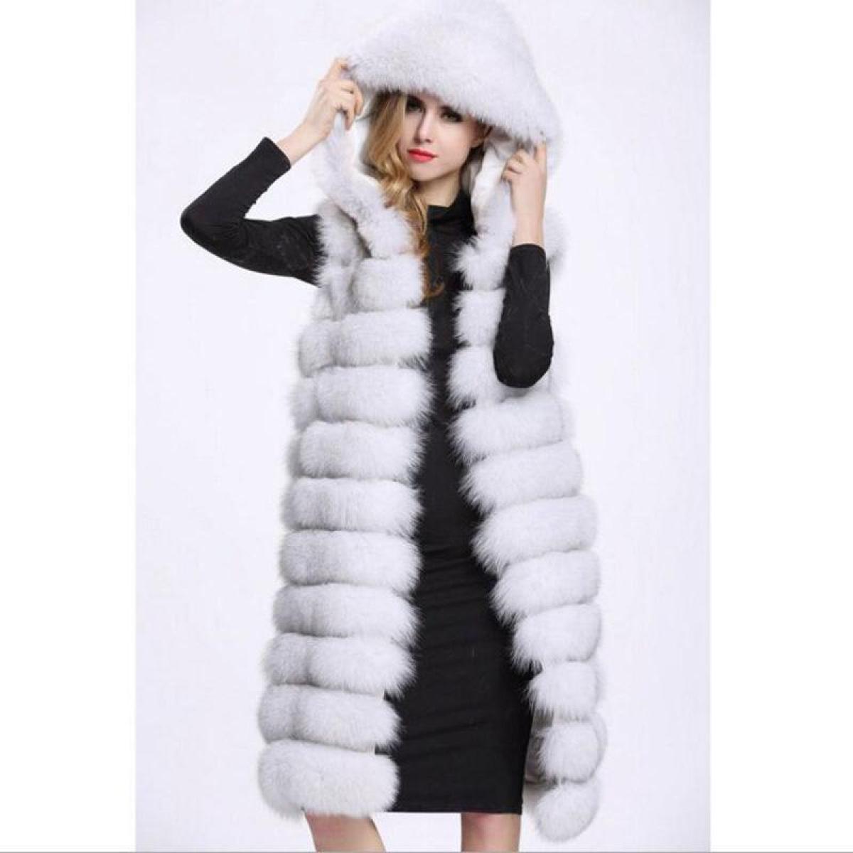 Woman wearing long black and white faux fur vest